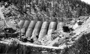 The new Eastwood dam under constructionin 1910, at Big Bear Lake. Note the original rock dam in the foreground.