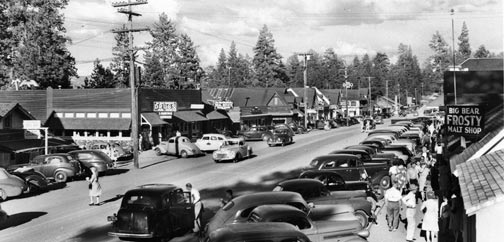 A busy summer weekend in the village looking east from the Cottage Lane Intersection. -- Rick Keppler Collection.